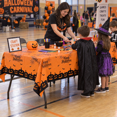 Happy Halloween orange plastic table cover 12 pack